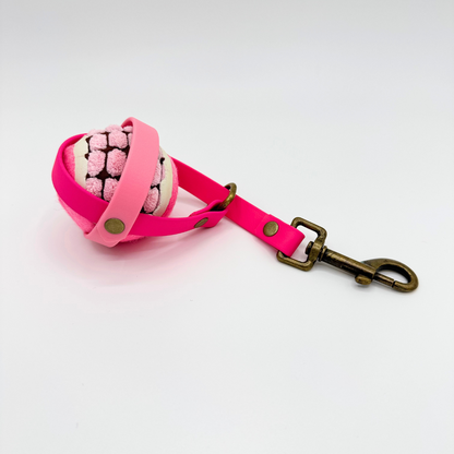 Pink ball holder with pink ball inside